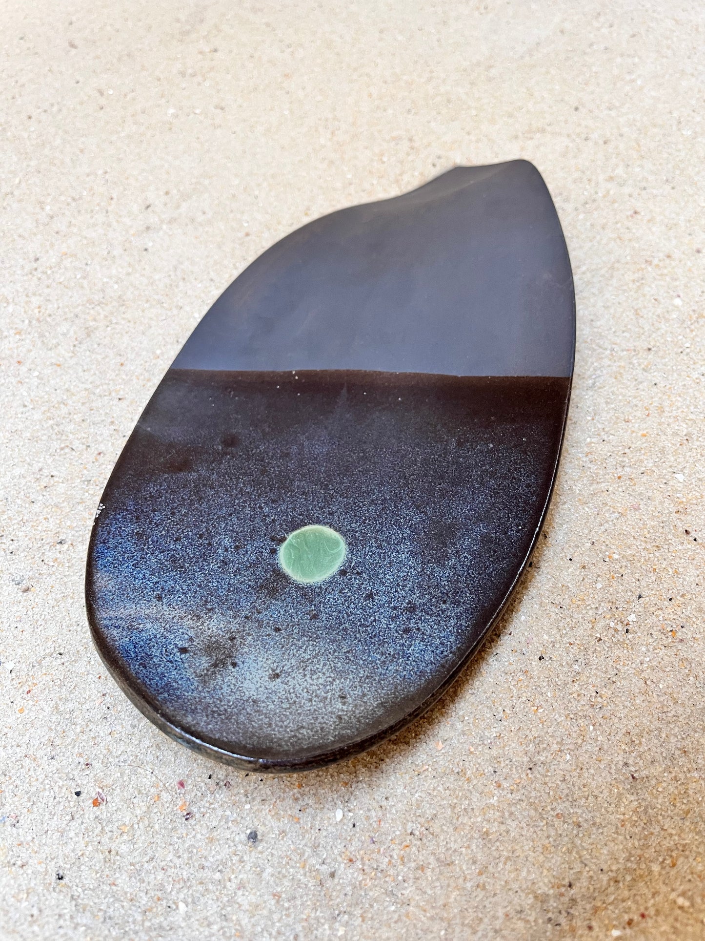 artistic ceramics with a green eye