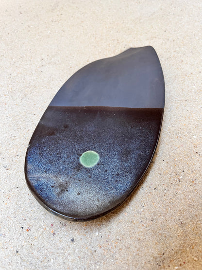 artistic ceramics with a green eye