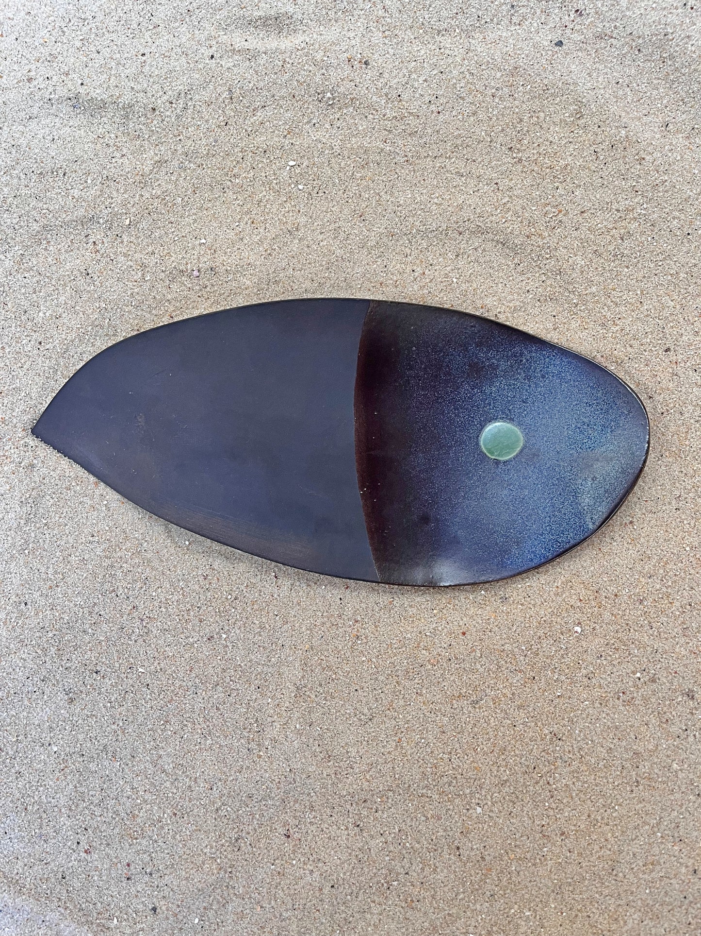 artistic ceramics with a green eye