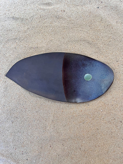 artistic ceramics with a green eye