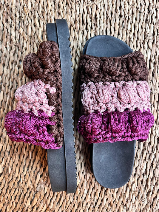 Crocheted sandals on the street, in the rain, on the tricolor farm
