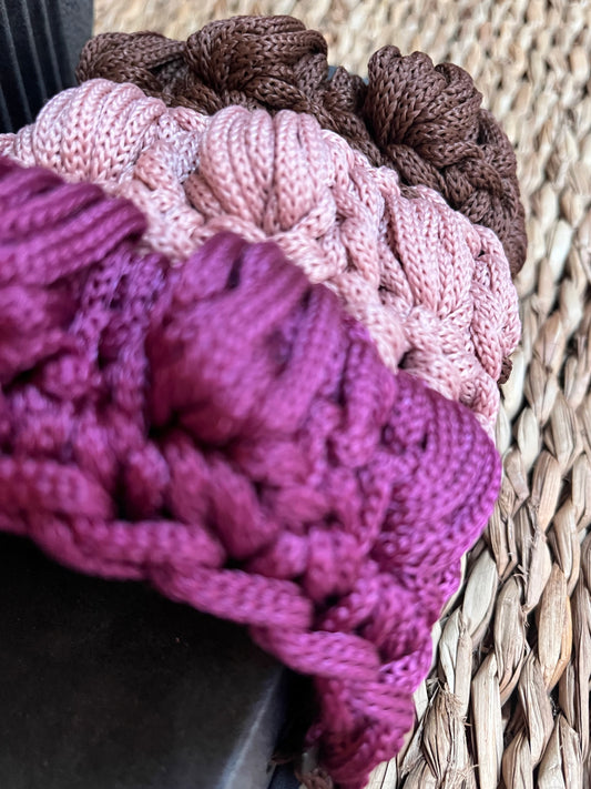 Crocheted sandals on the street, in the rain, on the tricolor farm