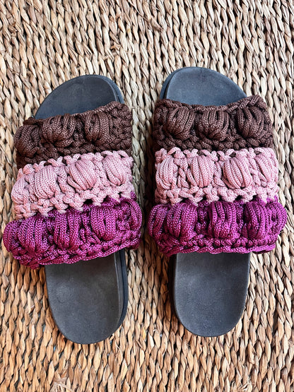 Crocheted sandals on the street, in the rain, on the tricolor farm