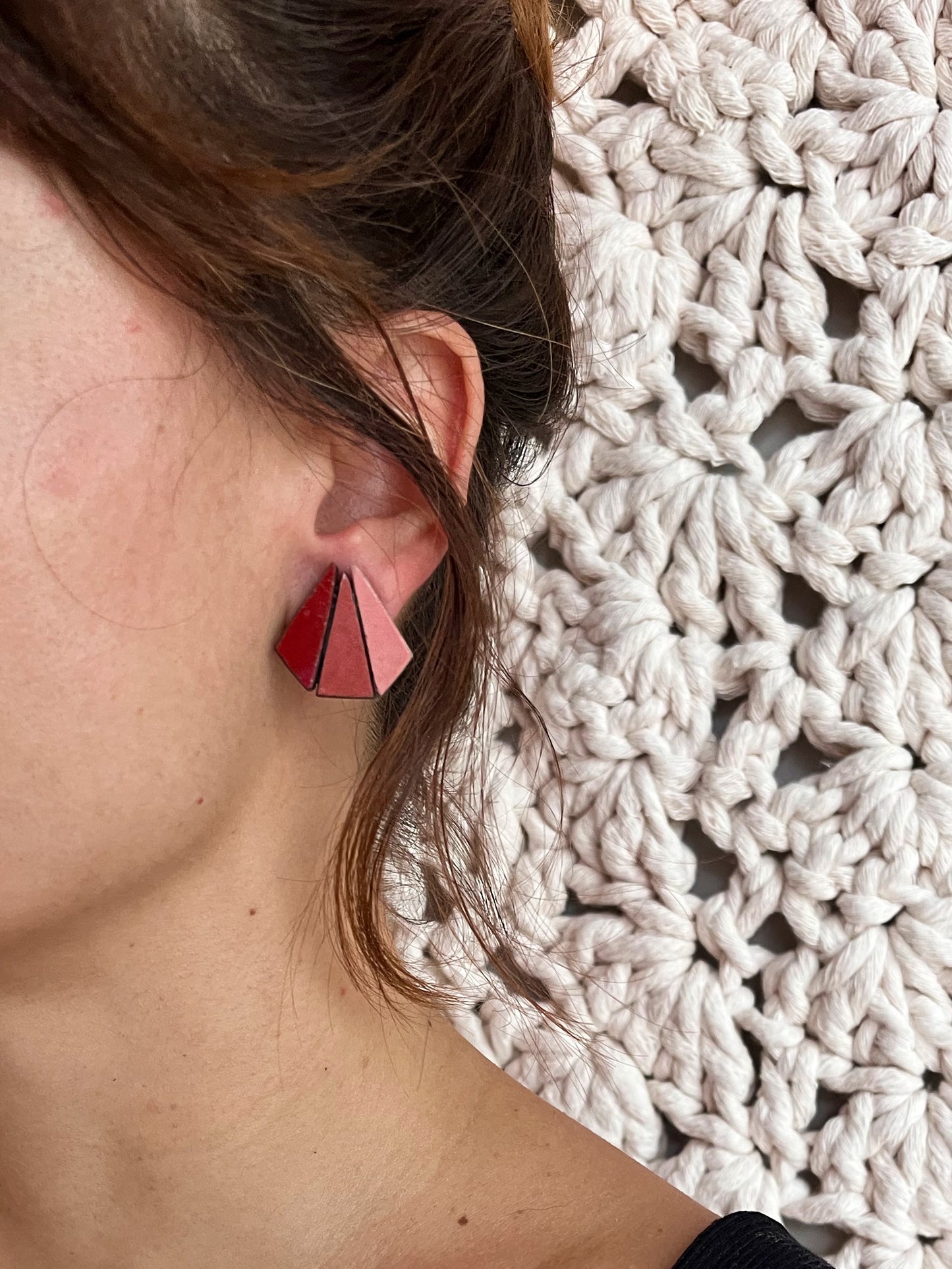 earring within a hug